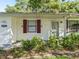 Close up of the front entrance of the home with tasteful landscaping at 2401 Greenlaw Ct, Leesburg, FL 34788