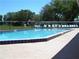 Inviting outdoor pool with lounge chairs, offering a relaxing space for residents to unwind and soak up the sun at 2401 Greenlaw Ct, Leesburg, FL 34788