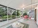 Screened porch with views of a large tree and outdoor seating at 2401 Greenlaw Ct, Leesburg, FL 34788