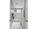 Bathroom features a shower and white vanity with a black and white tile floor at 25541 Troon Ave, Sorrento, FL 32776