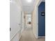 Hallway with neutral walls and carpet flooring leads to other rooms at 25541 Troon Ave, Sorrento, FL 32776
