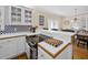 Kitchen with eat in counter and views to the dining area at 25541 Troon Ave, Sorrento, FL 32776
