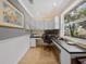 Bright office features built in cabinetry and a large window at 25541 Troon Ave, Sorrento, FL 32776