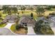Sprawling single-story home with a screened-in pool and views of the golf course at 2706 Radbourne Way, The Villages, FL 32162