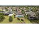 Home with a screened-in pool in a golf community at 2706 Radbourne Way, The Villages, FL 32162