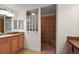 Bathroom featuring a tiled step-in shower with a built-in seat and decorative glass block window at 2706 Radbourne Way, The Villages, FL 32162