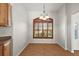 Cozy dining area with a large window and shutter-style blinds, offering a bright and airy ambiance at 2706 Radbourne Way, The Villages, FL 32162