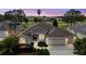 Charming single-story home with a well-manicured lawn and attached two-car garage at 2706 Radbourne Way, The Villages, FL 32162