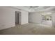 Bright main bedroom with plush carpeting and sliding glass doors leading to a private outdoor space at 2706 Radbourne Way, The Villages, FL 32162