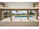 View from the covered patio overlooking the pool and golf course at 2706 Radbourne Way, The Villages, FL 32162