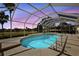 Screened pool with relaxing outdoor view, offering sunshine and swimming at 2706 Radbourne Way, The Villages, FL 32162