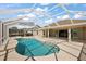 Relaxing screened pool with ample patio space and access to the home's interior at 2706 Radbourne Way, The Villages, FL 32162