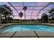 Beautiful, screened pool with open view of manicured landscaping and sunset at 2706 Radbourne Way, The Villages, FL 32162