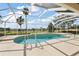 Inviting screened-in pool with golf course views at 2706 Radbourne Way, The Villages, FL 32162