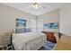 Cozy bedroom featuring beach-themed décor and a comfortable queen-sized bed with blue and white accents at 3584 Tropical Seas Loop, Tavares, FL 32778