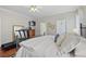 Bedroom featuring hard wood floors, ceiling fan, and a treadmill at 3584 Tropical Seas Loop, Tavares, FL 32778