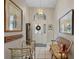 Inviting foyer with tile flooring, chandelier, and arched transom window above the door at 3584 Tropical Seas Loop, Tavares, FL 32778