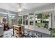Bright sunroom featuring a view of the spacious backyard at 3584 Tropical Seas Loop, Tavares, FL 32778