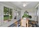 Relaxing sunroom with many windows overlooking lush backyard at 3584 Tropical Seas Loop, Tavares, FL 32778