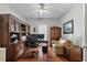 Traditional office space featuring hardwood floors, custom built-ins, and abundant workspace at 3584 Tropical Seas Loop, Tavares, FL 32778