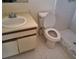 Bathroom showcasing a sink, and toilet with tiled flooring at 37 N Normandale Ave, Orlando, FL 32835