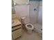 Bathroom featuring a shower, standard toilet, and a vanity sink with storage at 37 N Normandale Ave, Orlando, FL 32835