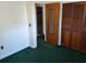 Bedroom featuring carpeted flooring and standard closet at 37 N Normandale Ave, Orlando, FL 32835
