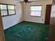 Bedroom features two windows with carpeted flooring and ceiling fan at 37 N Normandale Ave, Orlando, FL 32835