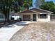 Charming single-story home featuring a garage and well-maintained landscaping at 37 N Normandale Ave, Orlando, FL 32835