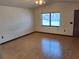 Inviting living room with wood-look flooring and natural light at 37 N Normandale Ave, Orlando, FL 32835
