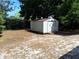 Backyard shed providing extra storage space, surrounded by trees at 37 N Normandale Ave, Orlando, FL 32835