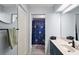 Charming bathroom features a celestial-themed shower curtain and a classic blue vanity at 38 Townhill Dr, Eustis, FL 32726