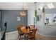 Inviting dining room with unique chandelier and gray accent wall at 38 Townhill Dr, Eustis, FL 32726