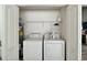 Convenient laundry room with washer, dryer, and water heater at 38 Townhill Dr, Eustis, FL 32726