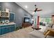 Stylish living room with a wet bar, comfortable seating and plenty of natural light at 38 Townhill Dr, Eustis, FL 32726