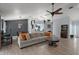 Spacious living room boasts tile floors, comfortable sectional sofa and access to the outdoors at 38 Townhill Dr, Eustis, FL 32726