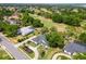 Aerial view featuring the home's manicured lawn, mature trees, and desirable location at 39206 Treeline Dr, Lady Lake, FL 32159