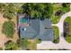 Aerial view showcasing the home's pool, lanai, and well-manicured landscaping at 39206 Treeline Dr, Lady Lake, FL 32159