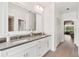 Elegant bathroom with dual sinks, stone countertops, and neutral decor at 39206 Treeline Dr, Lady Lake, FL 32159