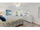 Bright bedroom features calming wall art and comfortable furnishings at 39206 Treeline Dr, Lady Lake, FL 32159