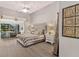 Bright bedroom with a large headboard and access to the lanai at 39206 Treeline Dr, Lady Lake, FL 32159