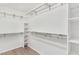 Walk-in closet offering ample storage space with shelving and hanging rods at 39206 Treeline Dr, Lady Lake, FL 32159