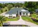 Beautiful home with a manicured lawn, landscaped garden, and a charming brick driveway at 39206 Treeline Dr, Lady Lake, FL 32159
