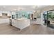 Bright kitchen with island, stainless appliances, and an open layout to the dining and living area at 39206 Treeline Dr, Lady Lake, FL 32159