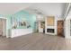 Expansive living area with a fireplace, wet bar, and stylish decor at 39206 Treeline Dr, Lady Lake, FL 32159