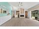 Bright open living space with fireplace, wet bar, and seamless access to the outdoor lanai with pool at 39206 Treeline Dr, Lady Lake, FL 32159