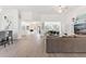 Open-concept living room with modern decor and plenty of natural light at 39206 Treeline Dr, Lady Lake, FL 32159