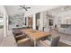 Inviting outdoor dining area with woven chairs and access to indoor living space and bar at 39206 Treeline Dr, Lady Lake, FL 32159