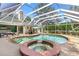 Private pool and spa with a screened enclosure, perfect for outdoor entertaining at 39206 Treeline Dr, Lady Lake, FL 32159