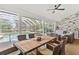 Relaxing screened-in pool and spa area with ample seating and outdoor kitchen at 39206 Treeline Dr, Lady Lake, FL 32159